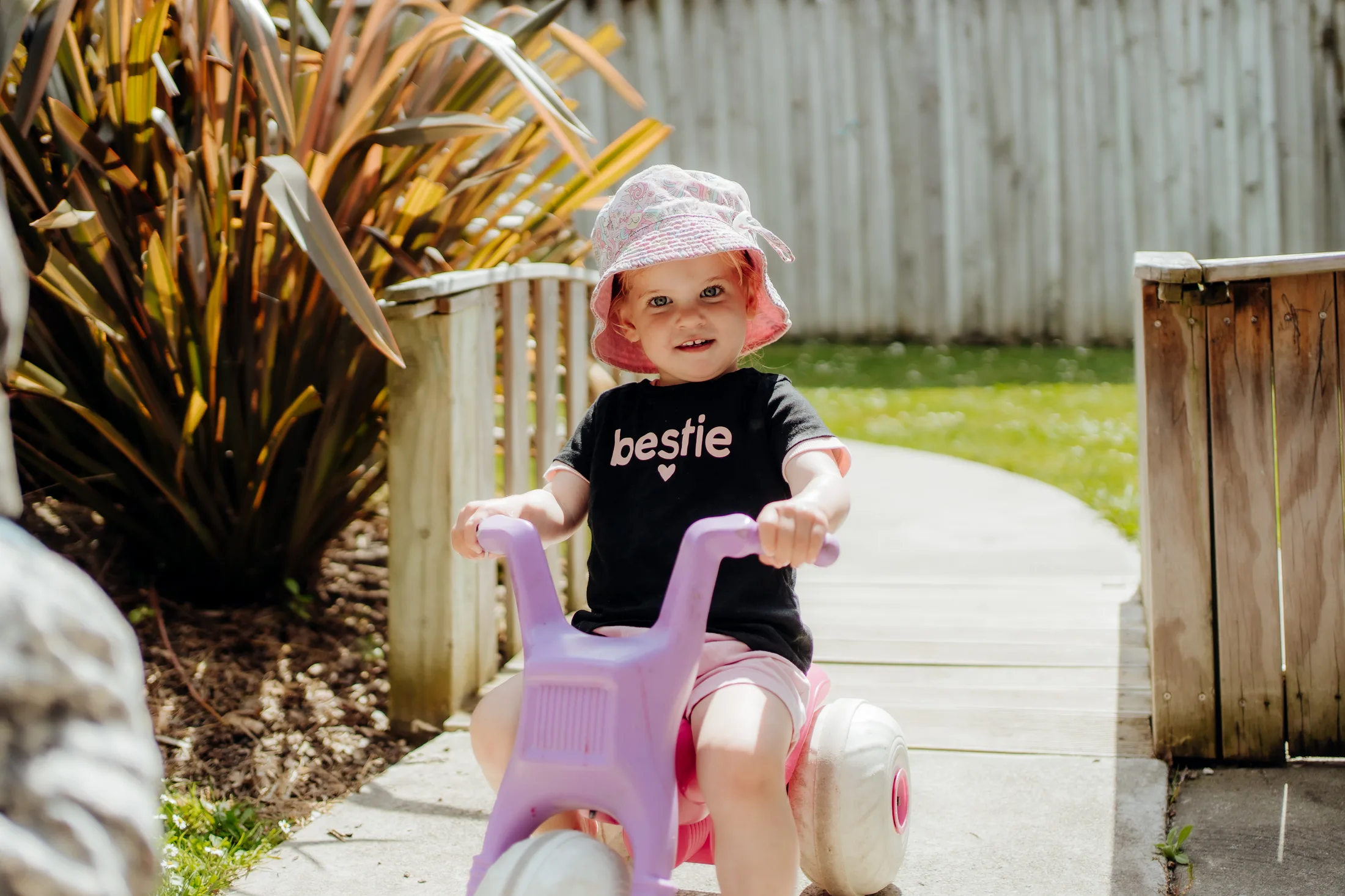 A young child riding outside