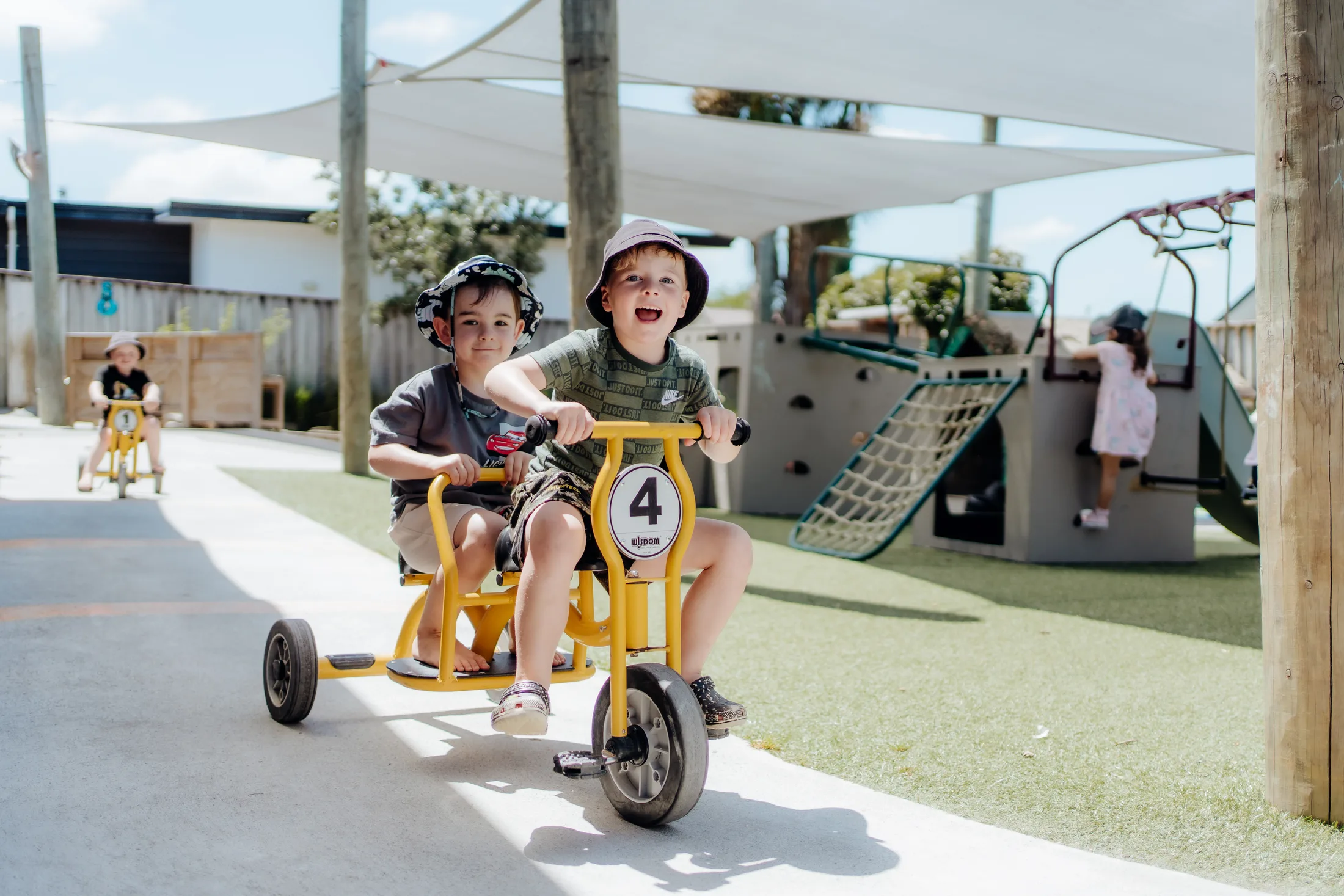 Children riding bikes around the centre track